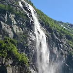 Family Cluster By Waterfall In *